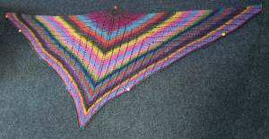A shawl pinned out for blocking.